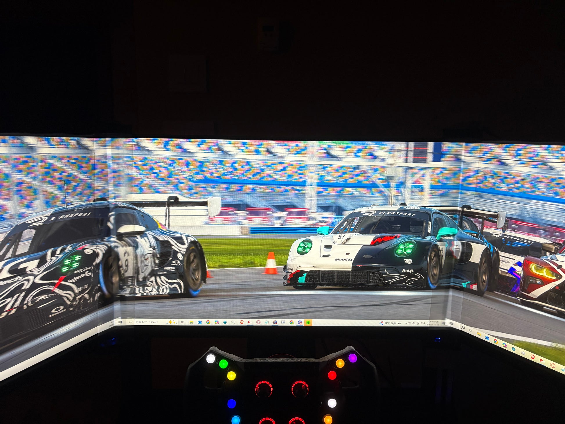 Desktop view with a bezel free kit connecting triple 27' monitors