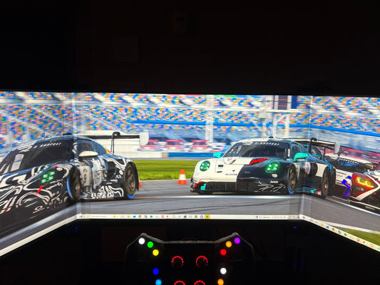 Desktop view with a bezel free kit connecting triple 27' monitors